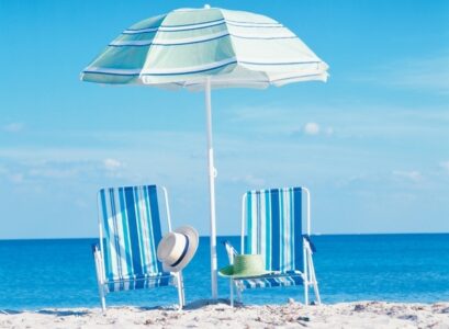 Folding-beach-chairs-blue-white-striped-fabric-small-beach-umbrella