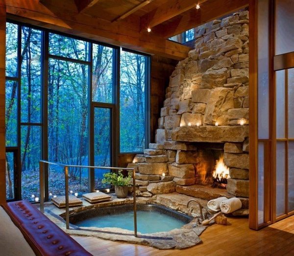 awesome indoor hot tub  stone wall wooden floor 