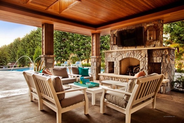 backyard ideas wooden patio furniture set stone fireplace