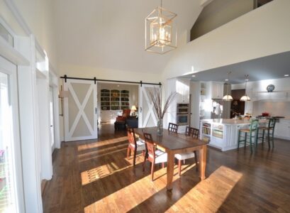 barn-doors-modern-home-interior-open-floor-plan-kitchen-dining-room