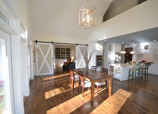 barn-doors-modern-home-interior-open-floor-plan-kitchen-dining-room
