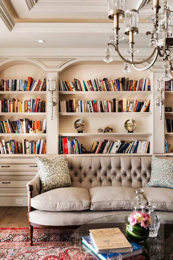 classic bookshelves sofa crystal chandelier
