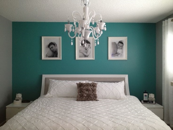 dark-teal-bedroom-wall color balanced with white furniture and chandelier