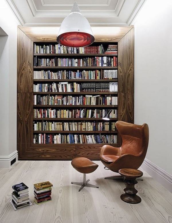 home-library furniture ideas wood shelves reading chair leather footrest