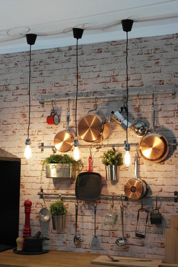 industrial kitchen ideas brick wall light bulbs wood counterop