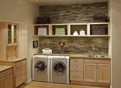laundry-room-cabinets-stone-wall-wood-flooring-open-shelves