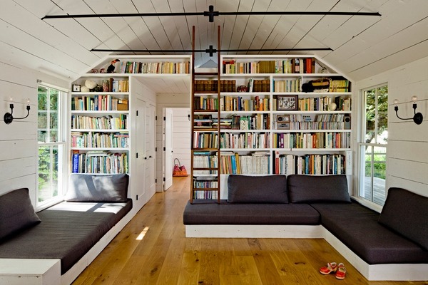 living room library bookshelves ladder corner sofa