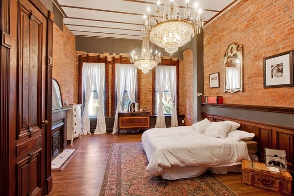 luxury bedroom ideas large chandeliers brick walls