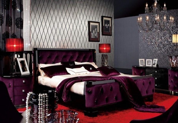 luxury master bedroom tufted bed red rug chandelier