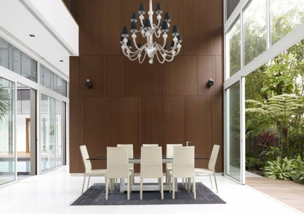 minimalist dining room white furniture brown wall oversized chandelier