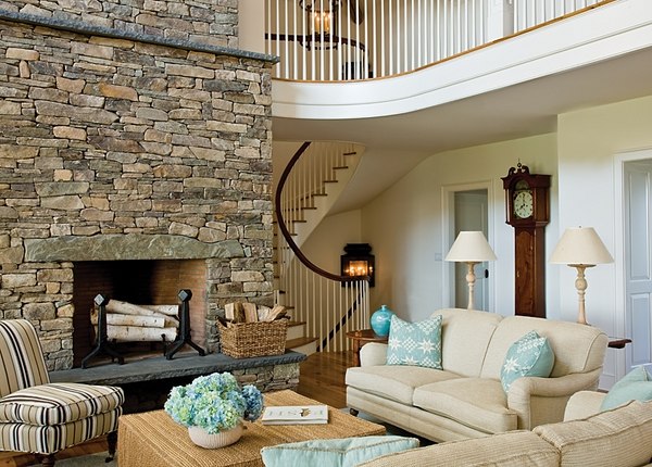 rustic living room design stone fireplace upholstered sofa armchairs 