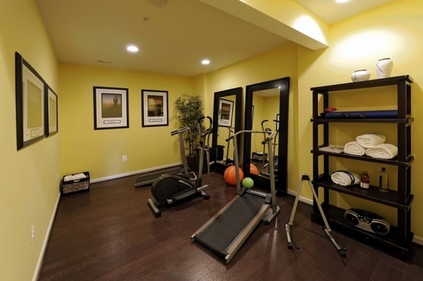 small home gym wood floor yellow wall paint