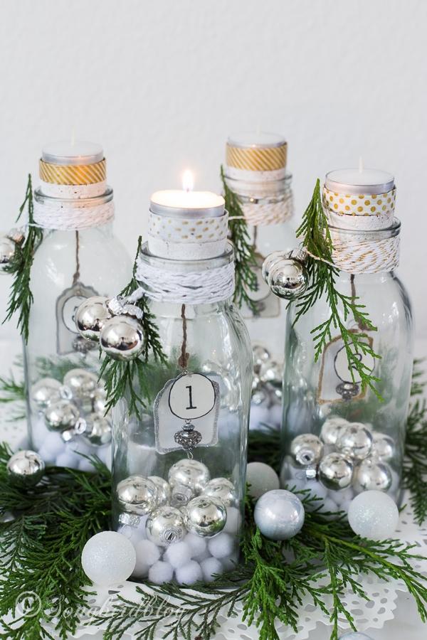   tea candles glass bottles small tree ornaments 