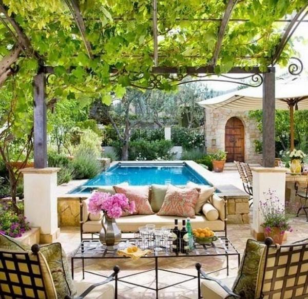 Mediterranean patio ideas grapevines outdoor wrought iron furniture