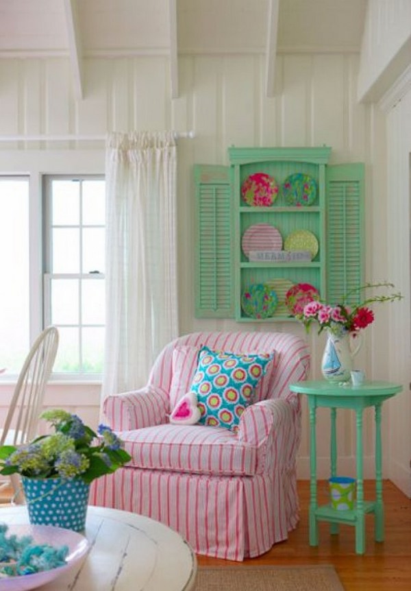  interior design cozy armchair white pink stipes green side table 