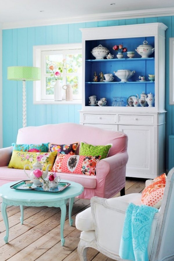  interior design vintage cupboard coffee table pastel blue wall color pink sofa