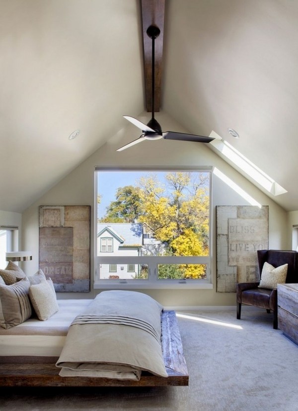 attic bedroom design wooden bed ceiling fan large window