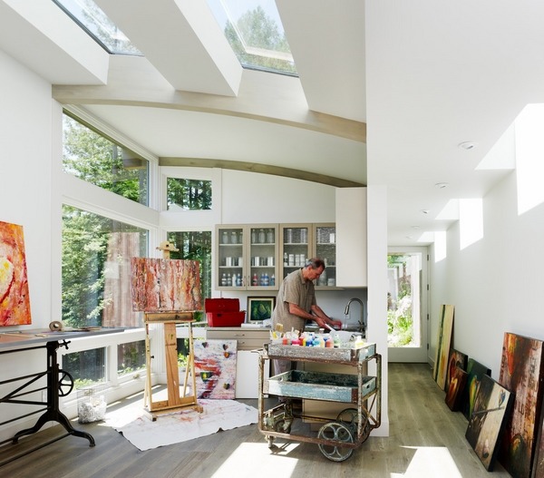contemporary home office art studio combo large windows skylights wall shelves