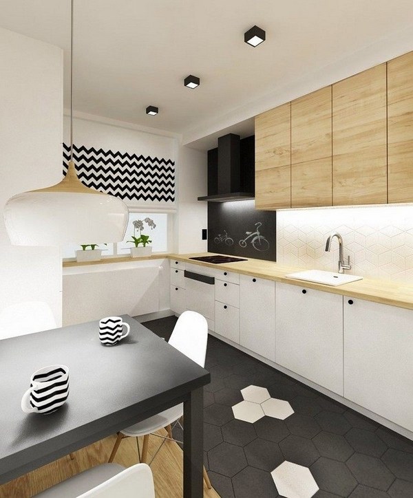 contemporary kitchen black accents white cabinets oak counertop