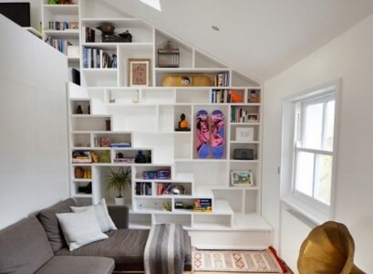 foxy-white-loft-storage-staircase-with-gray-sofa-and-shelf-under-stairs-unique-and-creative-stair-design-that-feature-space-saving-ideas-space-saving