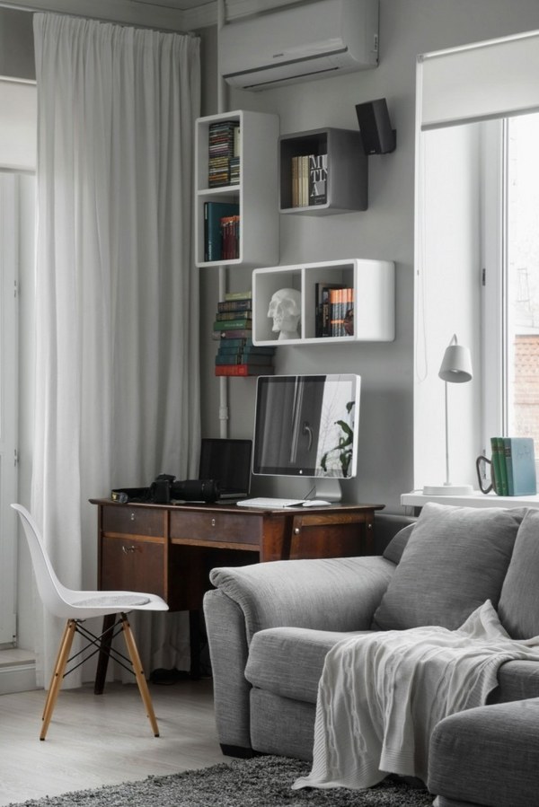 gray sofa wooden table wall bookshelf white curtain 