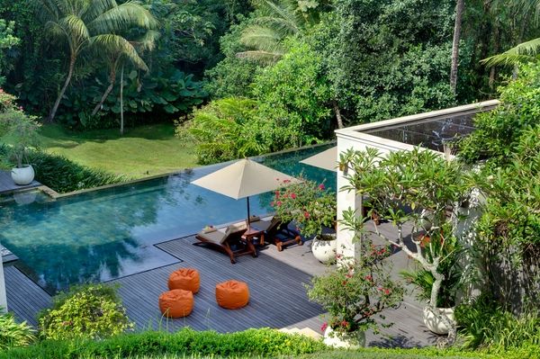 infinity garden pool wooden deck bean bags outdor umbrella