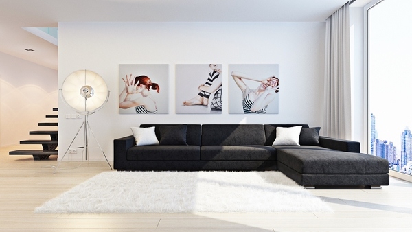 black sectional sofa white area rug wall photos