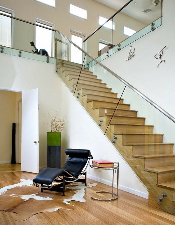 modern staircase designs glass railing white wall cowhide rug 