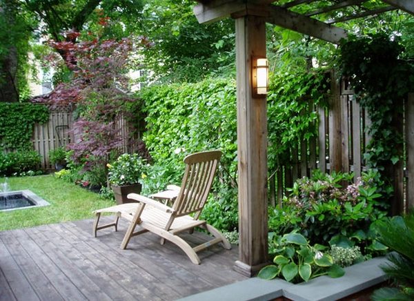 patio deck with grapevine arbor lounge chair backyard landscape