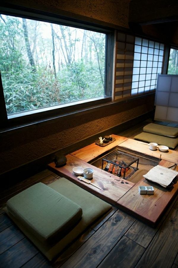 small dining area low wood table firepit Japanese style house ideas floor cushions
