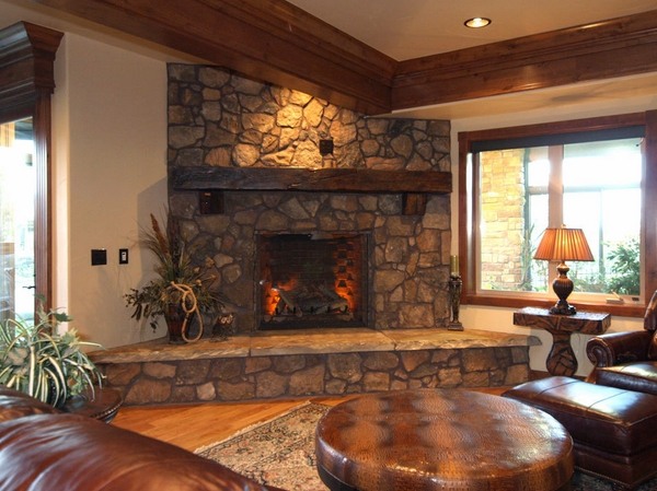 Large stone fireplace-Rustic-mantelpiece-ideas- solid wood leather sofa