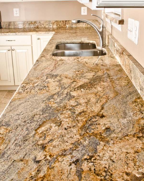 Yellow river granite countertops a unique feature in your place