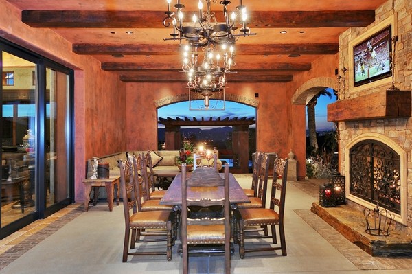 patio-dining-room-rustic-decor-stone-fireplace-wood-mantelpiece 