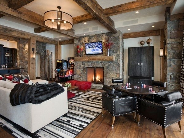 rustic living room-interior-leather-furniture-stone-fireplace-wood-mantelpiece