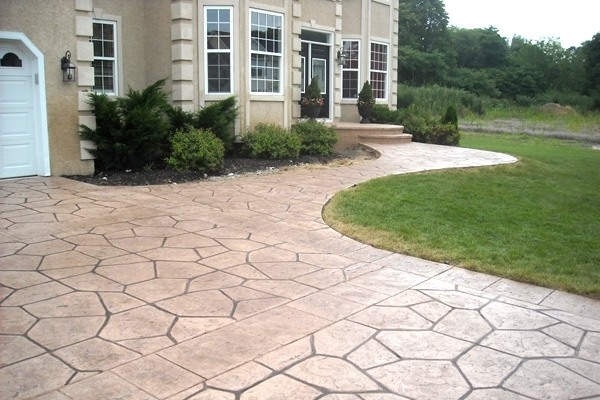 stamped concrete driveway pros cons vs concrete pavers 