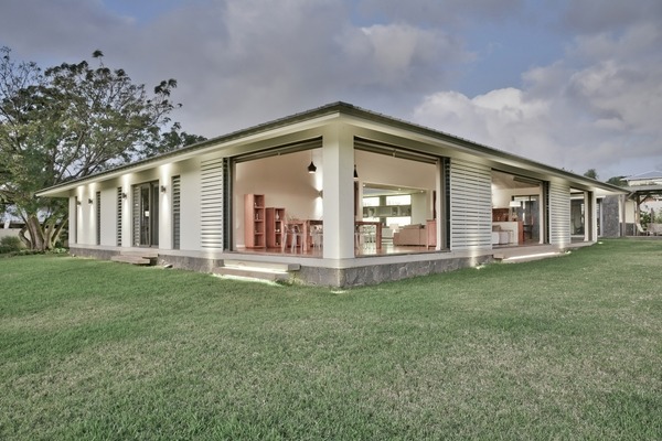 Contemporary family home sliding doors design by Rethink Studio