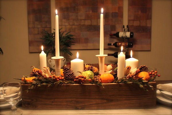 beautiful thanksgiving dinner decoration dining room table candles large pillar candle white candle holder pine cones pumpkin