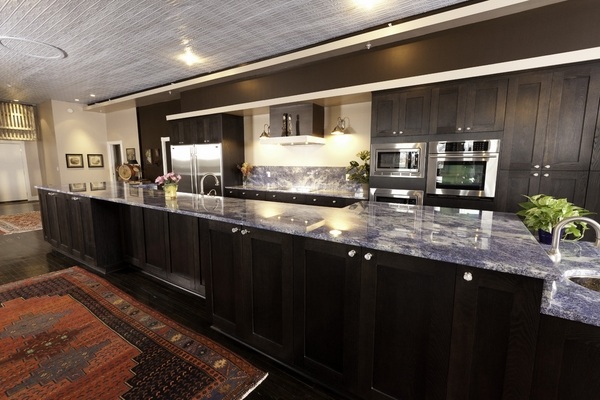 blue-granite-countertop-dark-wood-kitchen-cabinets-kitchen-remodel