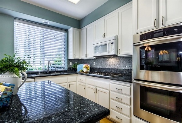 blue-granite-countertops-white-cabinets-kitchen-design-ideas