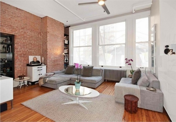 exposed-brick-wall-in-living-rooms-modern-home-design corner sofa