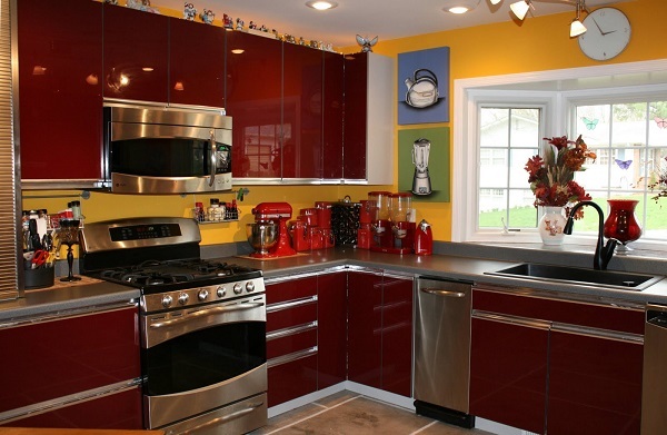 grey granite kitchen countertop red kitchen cabinets yellow wall