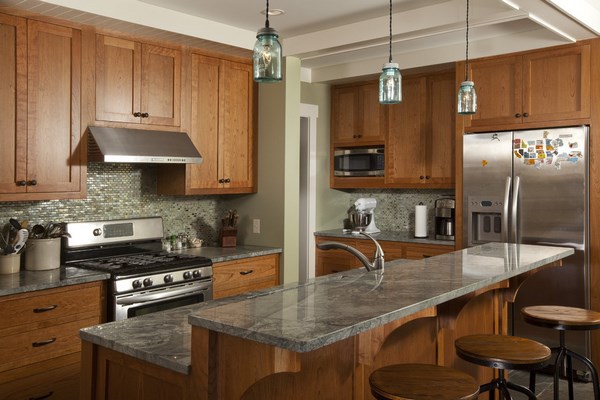 grey granite kitchen countertop wood cabinets pendant lighting 