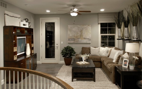 living room design-gray-wood-flooring brown sofa wooden coffee table