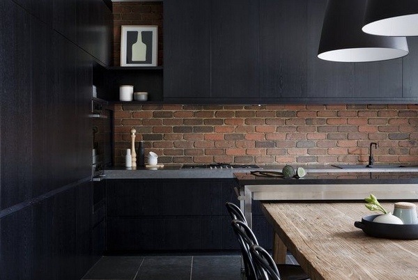 modern black kitchen design brick backsplash wooden table