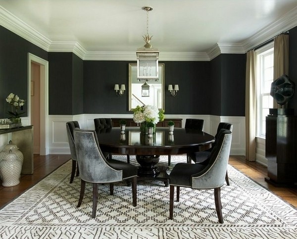 modern dining room black wall color black round table gray chairs