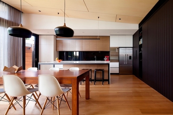 modern kitchen design ideas wood flooring wood cabinets black accent wall 