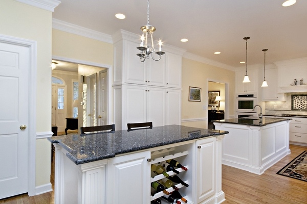 kitchen-with-double-island-blue-granite-countertops-white-cabinets