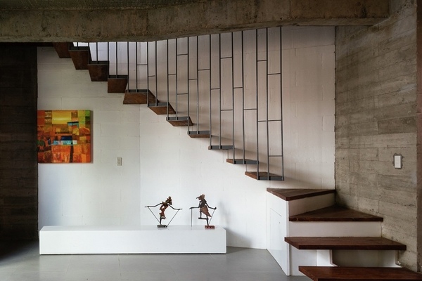 modern living area staircase design concrete wall