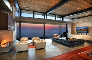 modern-living-room-design-ideas-black-leather-sofa-white-armchairs-modern-fireplace