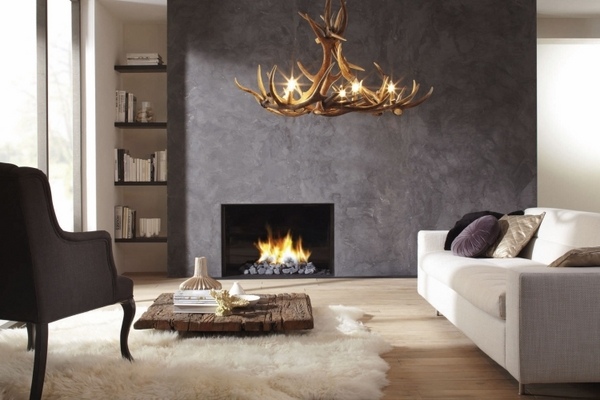 modern living room rustic decor gray accent wall gas fireplace antler chandelier